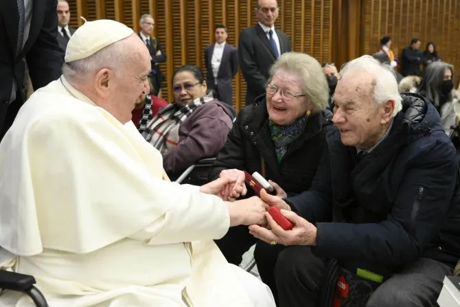 Pope Francis greets an elderly couple at his general audience on Jan. 11, 2023 | Vatican Media
