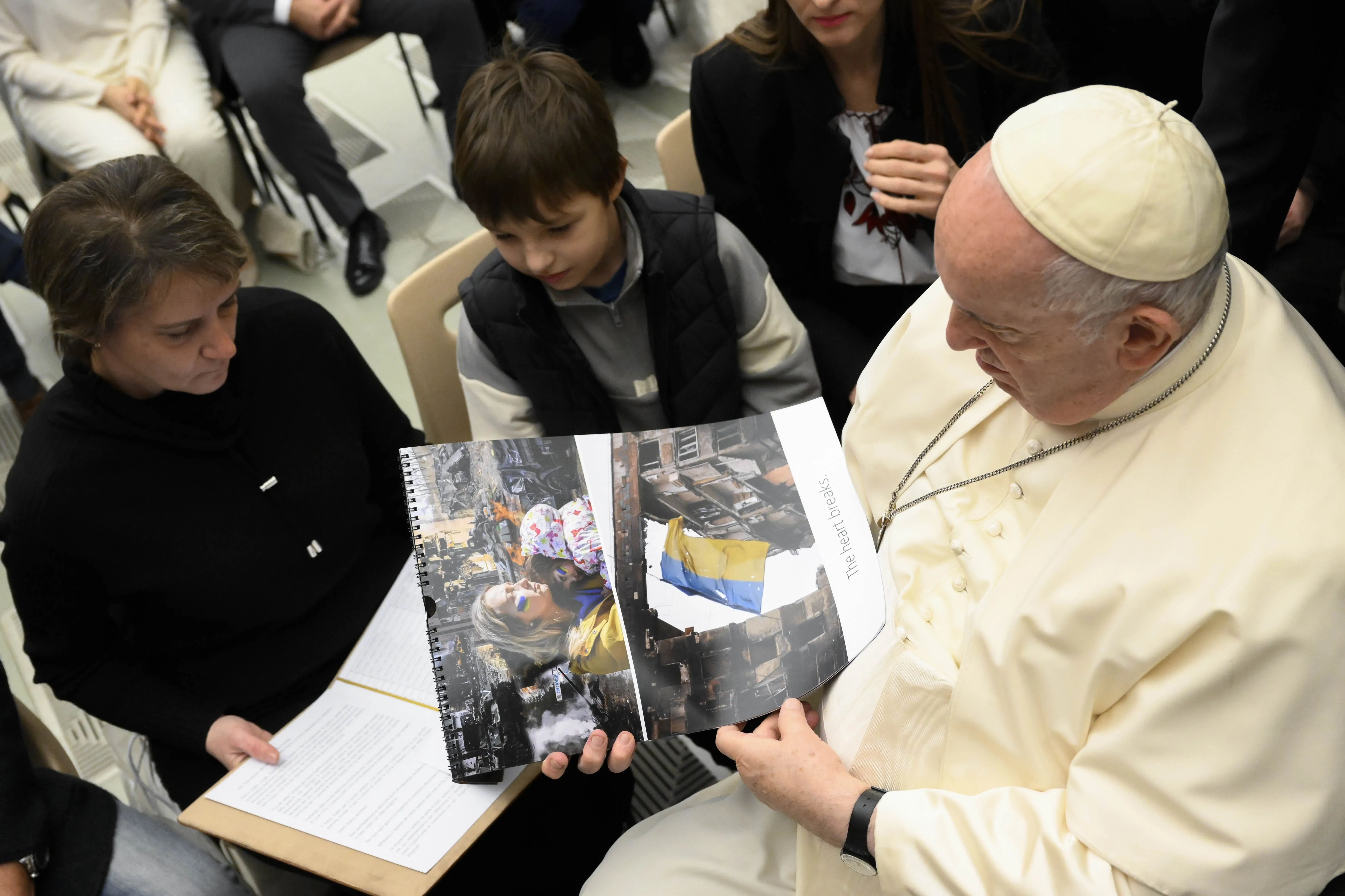 Pope Francis looking at images from Ukraine at the general audience, Dec. 21, 2022 | Vatican Media