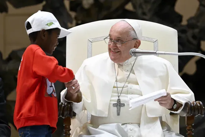 Pope Francis shakes hands with one of the approximately 7,000 children from around the world in the Vatican’s Paul VI Hall on Nov. 6, 2023, at an event sponsored by the Dicastery for Culture and Education dedicated to the theme “Let us learn from boys and girls.” | Credit: Vatican Media