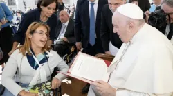 Giulia Cirillo gives Pope Francis a report from Catholics with disabilities on Sept. 21, 2022. | Vatican Media