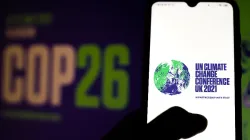 The 2021 UN Climate Change Conference (COP26) logo displayed on a smartphone. Rafapress via Shutterstock.
