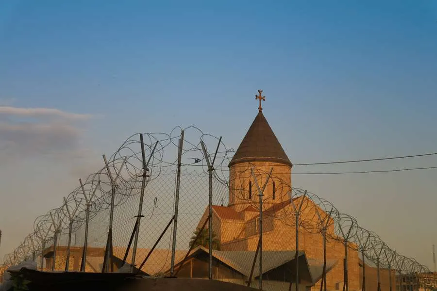 Armenian church behind barbed wire, Baghdad, Iraq. Via Shutterstock.