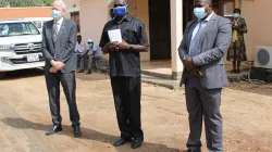 Fr. James Oyet Latansio (Center), UK ambassador Christopher Trott (left) and Christian Aid Country Director (right) after the launch  a helpline center for psychosocial and trauma healing of the people affected by COVID-19 in South Sudan. / ACI Africa