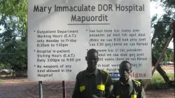 Security Officers at the entrance to the Mary Immaculate Hospital in Mapuordit, South Sudan.