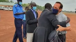 Acquitted Catholic Priest, Fr. John Mathiang Machol (in black cassock) welcoming the then Bishop-elect Christian Carlassare in Rumbek Diocese on 15 April 2021. Credit: Courtesy Photo