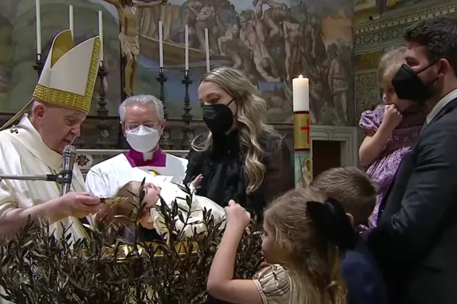 Pope Francis baptizes a child in the Sistine Chapel on Jan. 9, 2021. Screenshot from Vatican News YouTube channel.