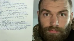 Major Serhiy Volyna, who has been leading the 36th marine brigade in the battle for the Ukrainian port city of Mariupol, pictured holding his letter to Pope Francis. Religious Information Service of Ukraine
