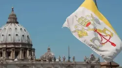 The Vatican flag and the dome of St. Peter's Basilica. | Credit: Bohumil Petrik/ACI