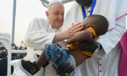 Pope Francis greets a young boy a Mass in Juba, South Sudan on Feb. 5, 2023. | Vatican Media