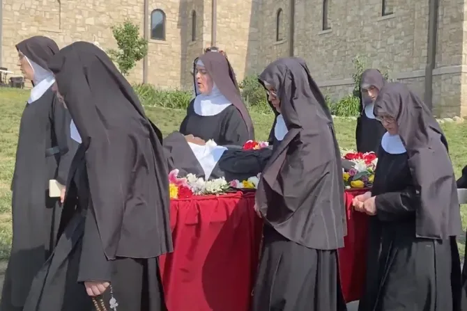 Religious sisters of the Benedictines of Mary, Queen of Apostles, sing as the process with the body of their late foundress, Sister Wilhelmina Lancaster, on May 29, 2023, at their abbey near Gower, Missouri. The sisters exhumed the nun's body on May 18 and discovered that it was apparently intact, four years after her death and burial in a simple wooden coffin. | Joe Bukuras/CNA