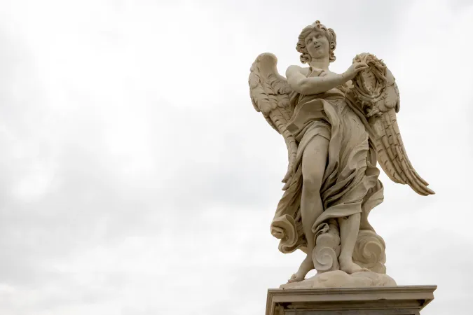 An angel holding the crown of thorns gazes heavenward, showcasing the delicate craftsmanship of Bernini's design against the Roman sky.