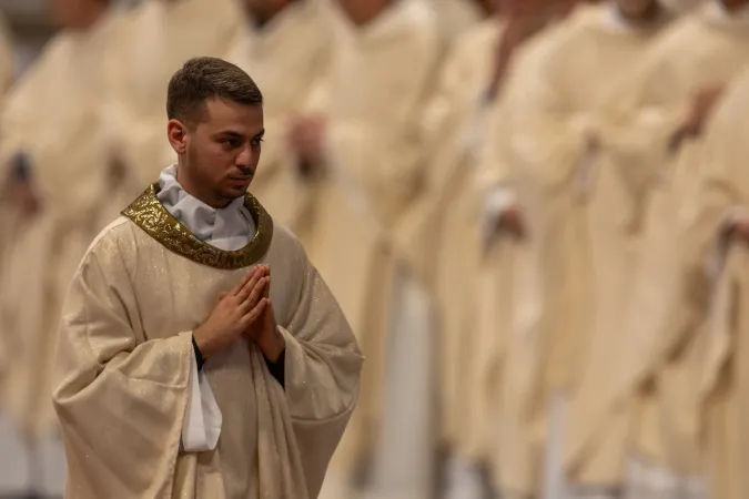A newly ordained priest prays during the ordination Mass celebrated by Pope Leo XIV at St. Peter's Basilica on May 31, 2025.