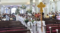 Children process into the St. Mary al-Tahir Church, also known as the Church of the Immaculate Conception, in Baghdad, for their first Communion. / Credit: Chaldean Catholic Church