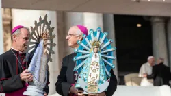 Bishop Paul Mason of the UK Armed Forces (L) and Bishop Santiago Olivera of the Argentine Armed Forces hold statues of Our Lady of Lujan in St. Peter's Square, Oct 30, 2019. Credit: Daniel Ibanez/CNA.
