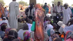 Displaced Sudanese gather and sit in makeshift tents after fleeing Al-Fashir city in Darfur. Credit: Vatican Media