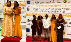 Caritas Freetown staff receive Women's Forum Sierra Leone award on behalf of Fr. Peter Konteh. Credit: Archdiocese of Freetown Freetown -Communications Unit