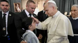 Pope Leo XIV blesses a child at the De La Croix Hospital for the mentally disabled in Jal el Dib, north of Beirut, Lebanon, on Dec. 2, 2025. | Credit: Vatican Media