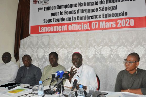 Archbishop Benjamin Ndiaye of Senegal's Dakar Archdiocese with members of Caritas Senegal at the press conference to Launch the Fuudraising campaign, Saturday, March 7, 2020.