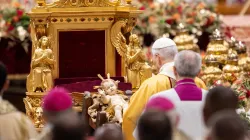 Pope Leo XIV venerates a statue of the Child Jesus during the celebration of Christmas Mass during the Night in St. Peter's Basilica on Dec. 24, 2025. / Credit: Daniel Ibanez/CNA.