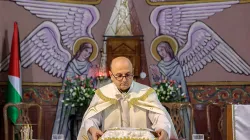 Father Gabriel Romanelli, parish priest at the Roman Catholic Church of the Holy Family who was wounded in a recent strike on the church, stands before the altar during a Sunday morning Mass held by the Latin patriarch of Jerusalem at the church in Gaza City on July 20, 2025. / Credit: OMAR AL-QATTAA/AFP via Getty Images