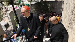 Latin Patriarch of Jerusalem Pierbattista Pizzaballa (L) and a members of a Christian visit the Saint Porphyrius Church in Gaza City on July 18, 2025. / Credit: OMAR AL-QATTAA/AFP via Getty Images