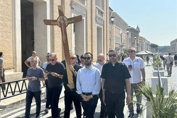 Seminarians approach the Holy Door at St. Peter’s Basilica on Tuesday, June 24, 2025. / Credit: Courtney Mares/CNA