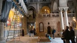 The interior of the Basilica of the Holy Sepulcher in Jerusalem. In the center, the Stone of Anointing, with Calvary in the background. | Credit: Marinella Bandini