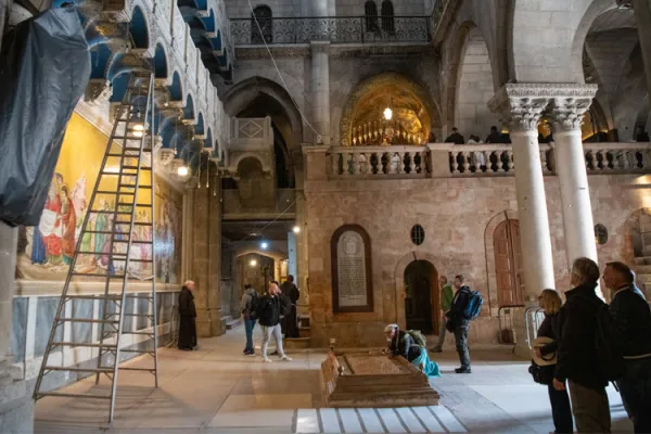 The interior of the Basilica of the Holy Sepulcher in Jerusalem. In the center, the Stone of Anointing, with Calvary in the background. | Credit: Marinella Bandini