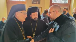 Melkite Greek Catholic Patriarch Youssef Absi of Antioch (left) and Father Chihade Abboud, rector and parish priest of the Basilica of Santa Maria in Cosmedin (center), speak with Melkite Catholic Elie Bassila. Members of the Lebanese Catholic diaspora are anticipating Pope Leo XIV’s three-day visit to Lebanon, taking place from Nov. 30 to Dec. 2, 2025. / Credit: Photo courtesy of Elie Bassila