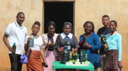 Sr. Teresa Mulenga with some community members displaying locally made soap. Credit: Sr. Teresa Mulenga