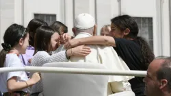 Youngsters surrounding Pope Francis in the popemobile. / Credit: Vatican Media