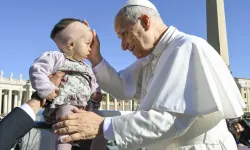 Pope Leo XIV blesses a baby in St. Peter’s Square during his general audience on Wednesday, Nov. 5, 2025, at the Vatican. / Credit: Vatican Media