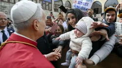 Pope Leo XIV greets a young mother and her child outside of the Monastery of St. Maron in Annaya, Lebanon, on Dec. 1, 2025. / Credit: Vatican Media