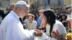 Pope Leo XIV greets a young woman along the streets of Albano, Italy before offering Mass in the Cathedral Basilica of Saint Pancras near Castel Gandolfo on July 20, 2025. / Vatican Media