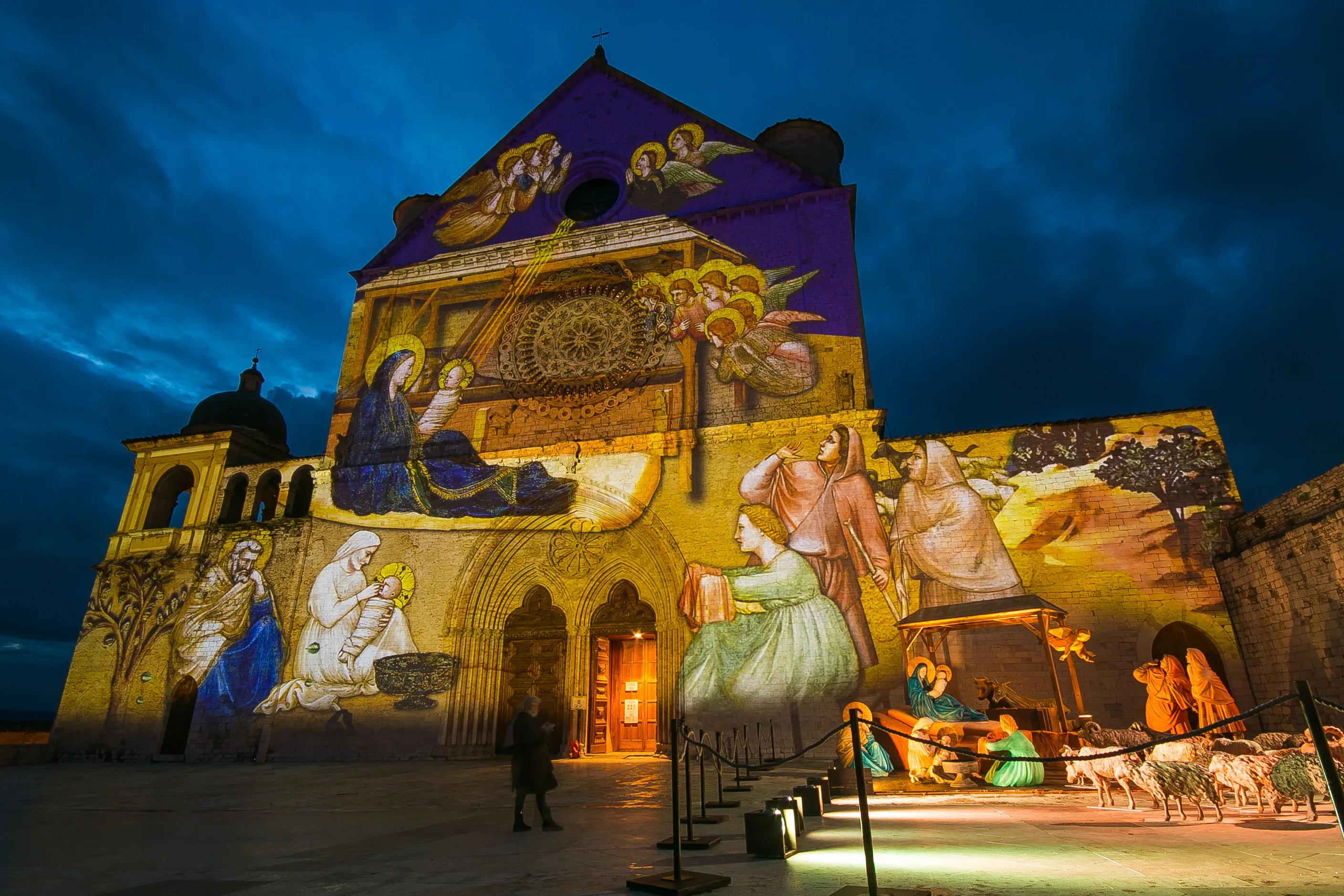Giotto's Nativity fresco projected on the Basilica of St. Francis of Assisi.