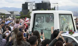 Pope Leo XIV interacts with a baby before celebrating Mass in Beirut, Lebanon, on Dec. 2, 2025. / Credit: Vatican Media