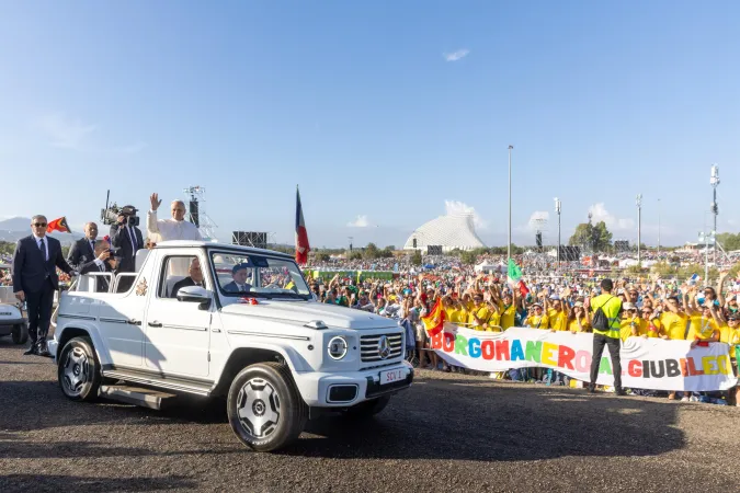 Pope Leo XIV waves at teens and young adults who spent all night Aug. 2-3, 2025, camping out at the University of Rome Tor Vergata before the closing Mass of the Jubilee of Youth.